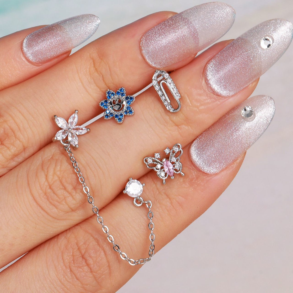 piercing plateada de flor, piercing doble, piercing de flor con piedra, piercing largo