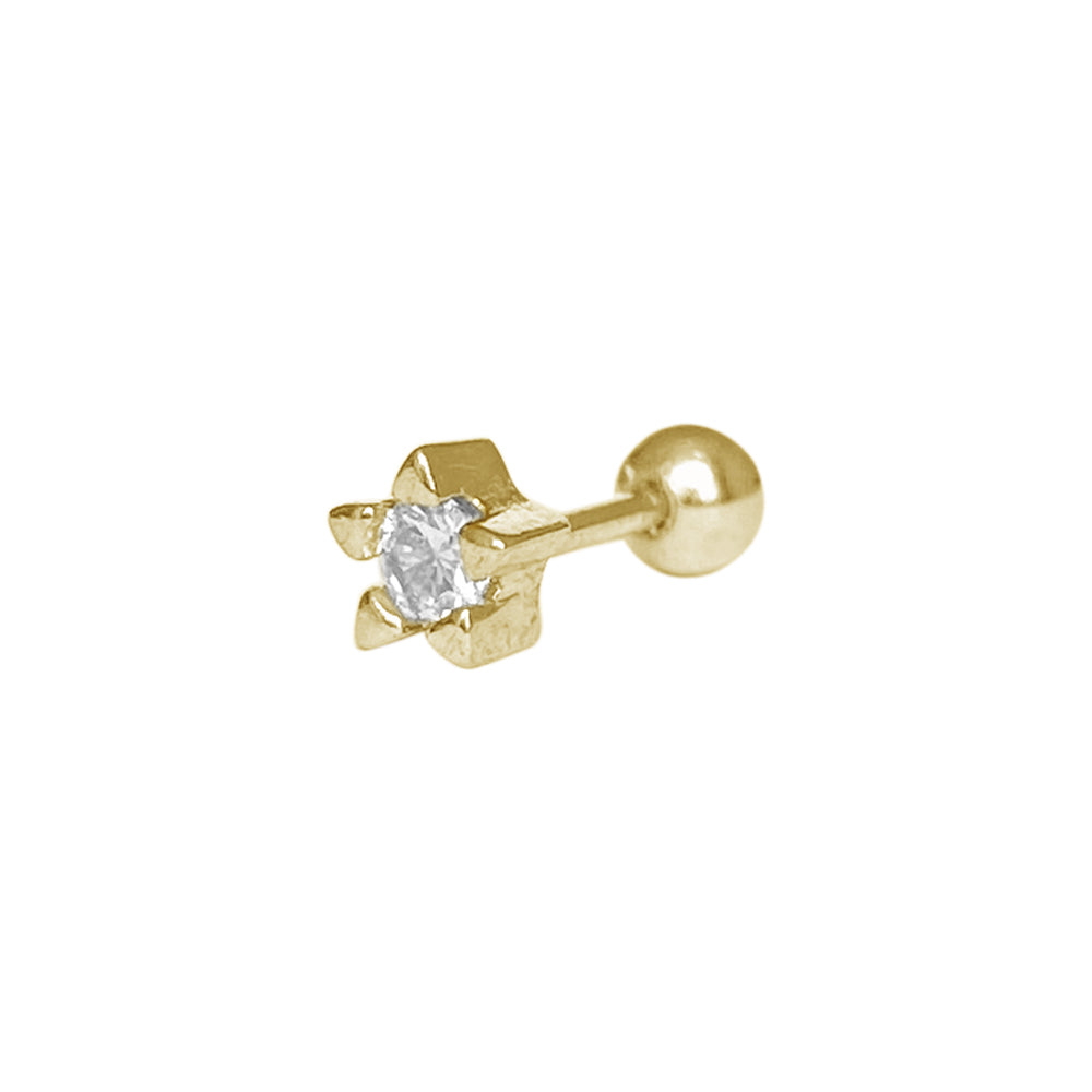 Piercing en forma de estrella dorada con piedra al centro 