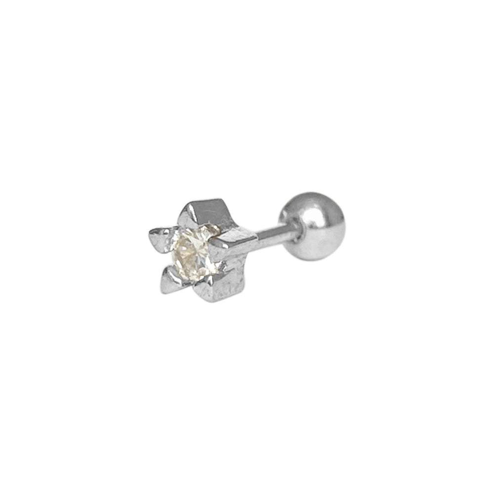 Piercing en forma de estrella plateada con piedra al centro 