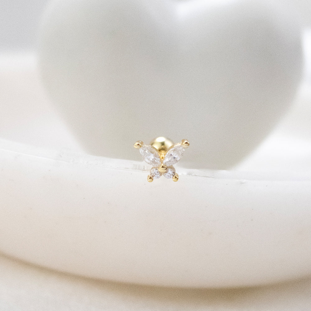 Piercing en forma de mariposa con piedras dorado 